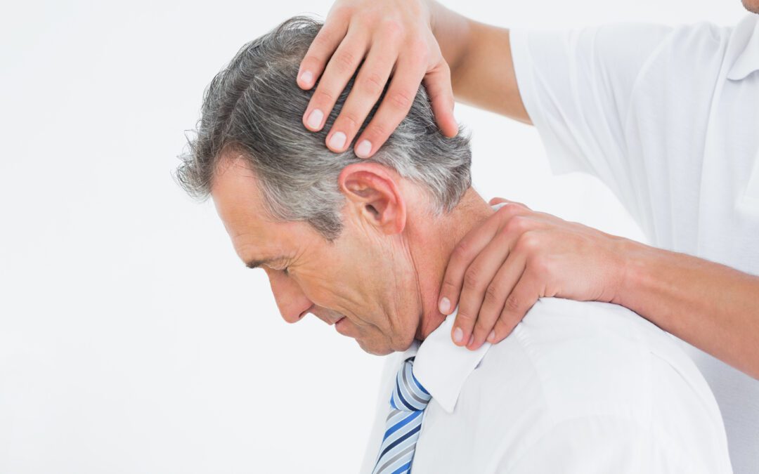 Side view of a chiropractor doing neck adjustment